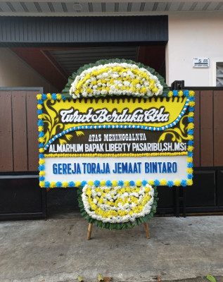 Papan Bunga Duka di Yaniruma